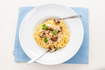 Spaghetti carbonara with brown mushroom