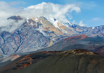 The cone of the Ostry Tolbachik volcano on the background of blue sky - Kamchatka, Russia