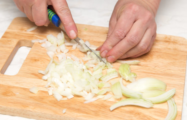 Cook chopped onion on the board