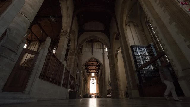 ROTTERDAM, NETHERLANDS - AUGUST 05, 2016: Timelapse low angle shot of people in St. Lawrence Church. Interior of Protestant Church which was built between 1449 and 1525