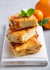 Orange cheesecake slices on board