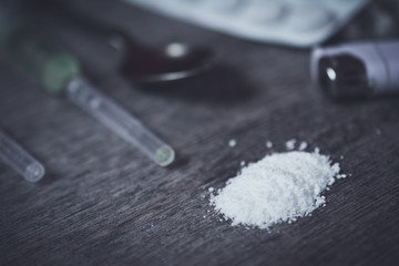 Images of needles and drug. The picture is staged and there is no real drugs. (vintage Image)