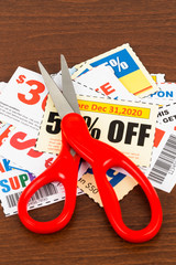 Saving discount coupon voucher with scissors, coupons are mock-u