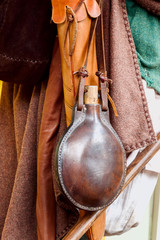 Medieval etnik water flask, cover in a leather case and quiver for arrows