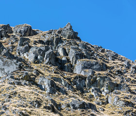 View of the rocky side of a mountain in the valley of the Dudh K
