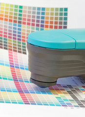 Spectrometer used for proofing on a leaf of the test print