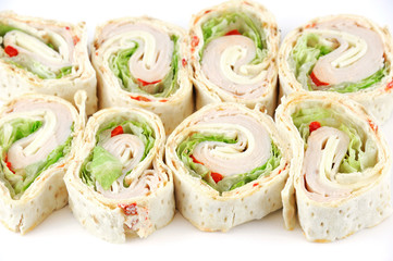 tortilla deli wrap rolls with ham vegetable isolated on white background