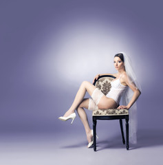 Naklejka premium Young woman posing in erotic wedding lingerie