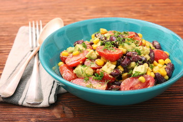 Black bean salad with avocado, corn and tomato. healthy food concept