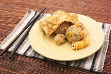 Creative idea for kids snack, breakfast, lunch. Sleeping bear from rice under the blanket of egg omelet. Fun, healthy kids meal. Art of food