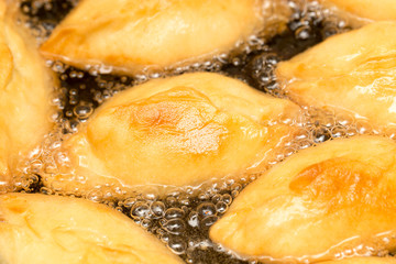 patties are fried in a pan