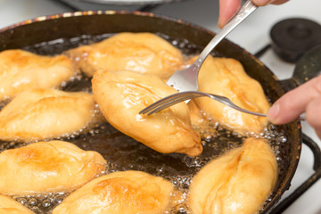 patties are fried in a pan