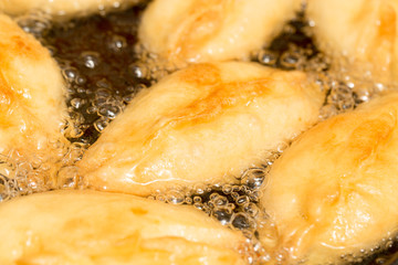 patties are fried in a pan