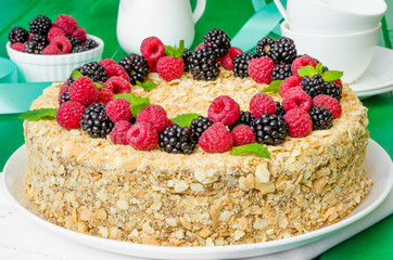 Festive Napoleon cake with chocolate custard and berries on top