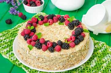 Festive Napoleon cake with chocolate custard and berries on top