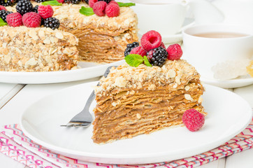 Festive Napoleon cake with chocolate custard and berries on top