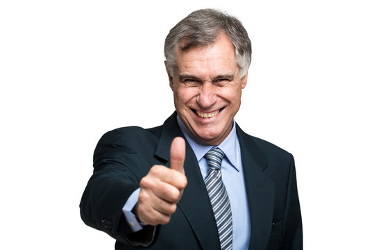 Businessman doing thumbs up sign
