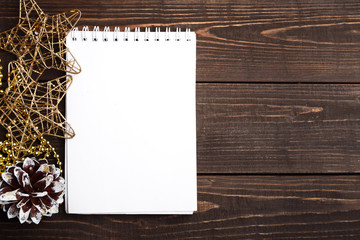 Christmas blank notebook on the brown wooden table