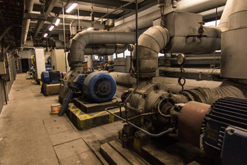 some old, dusty, pumps for hot and cold water