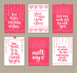 Set Valentine's Day greeting cards with handwritten brush calligraphy and decorative elements.
