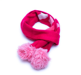 Knitted red scarf with pompoms with on white background.