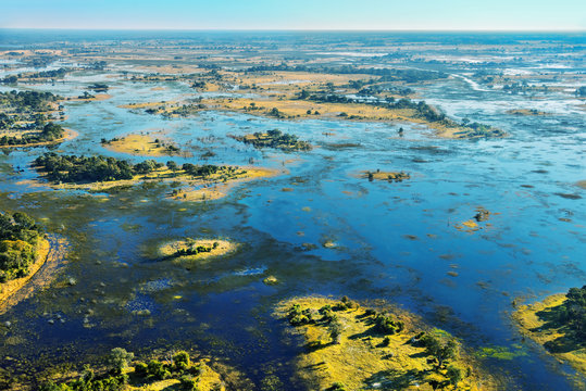 The Victoria falls is the largest curtain of water in the world (1708 m wide). The falls and the surrounding area is the National Parks and World Heritage Site (helicopter view) - Zambia, Zimbabwe