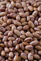 pinto beans on wooden surface