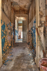 Fototapeta na wymiar Corridor in the abandoned and rotten rural school