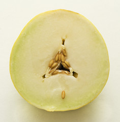 Honeydraw melon cut in half