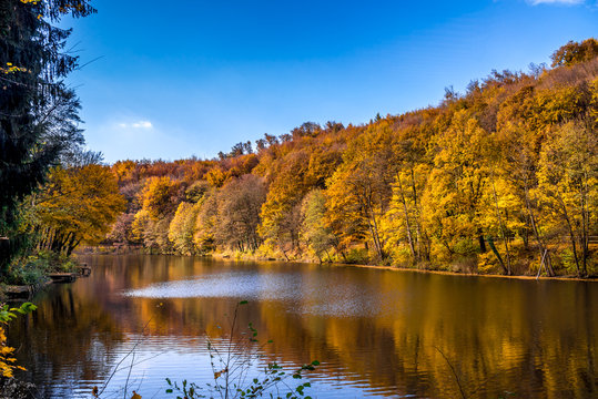 Fototapeta Colorful lake landscape, reflection in water, late autumn in Bratislava