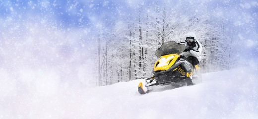 Winter background with man on snowmobile