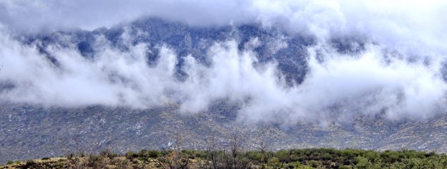 Winter clouds lay low on a mountain range in southwest Arizona.