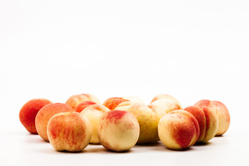Copy space with ripe peaches on whit background 