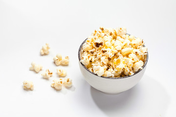 Popcorn in a dish on a white