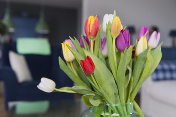 Vase with tulips in interior