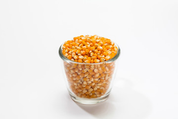 Fototapeta na wymiar Dried corn kernels on a glass
