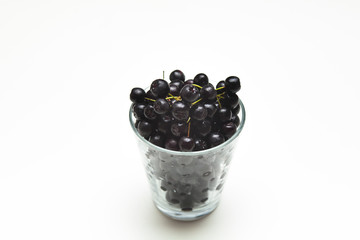 Iceberry and glass on a white