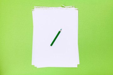 Note and Green pencil on a green