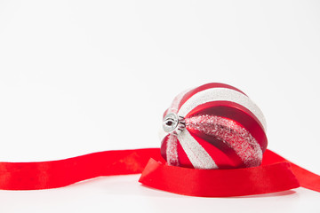 Red christmas ball on ribbon