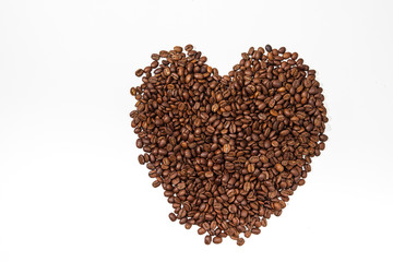 Heart symbolly composed of coffee beans 
