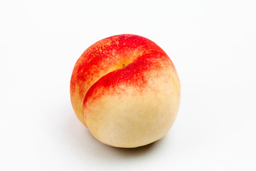 Fototapeta na wymiar Isolated well ripe peach on a white 