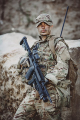 Fototapeta premium Army sniper during the military operation in the mountain. war,