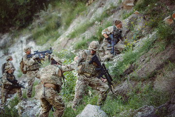 Army sniper during the military operation in the mountain. war,