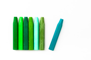 Fototapeta premium Green color of oil crayons on a white 