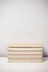 Stack books on a desk 