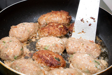 cutlets fried in a pan