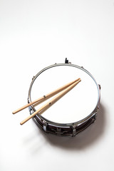Drum and Drumsticks on white background 