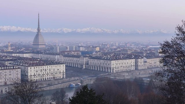 Turin panorama time-lapse from morning twilight to day with Mole Antonelliana and Alps
