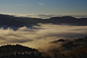 Fog in the valleys near Florence at sunrise.