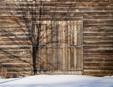 Old Wooden Barn Door in Snow